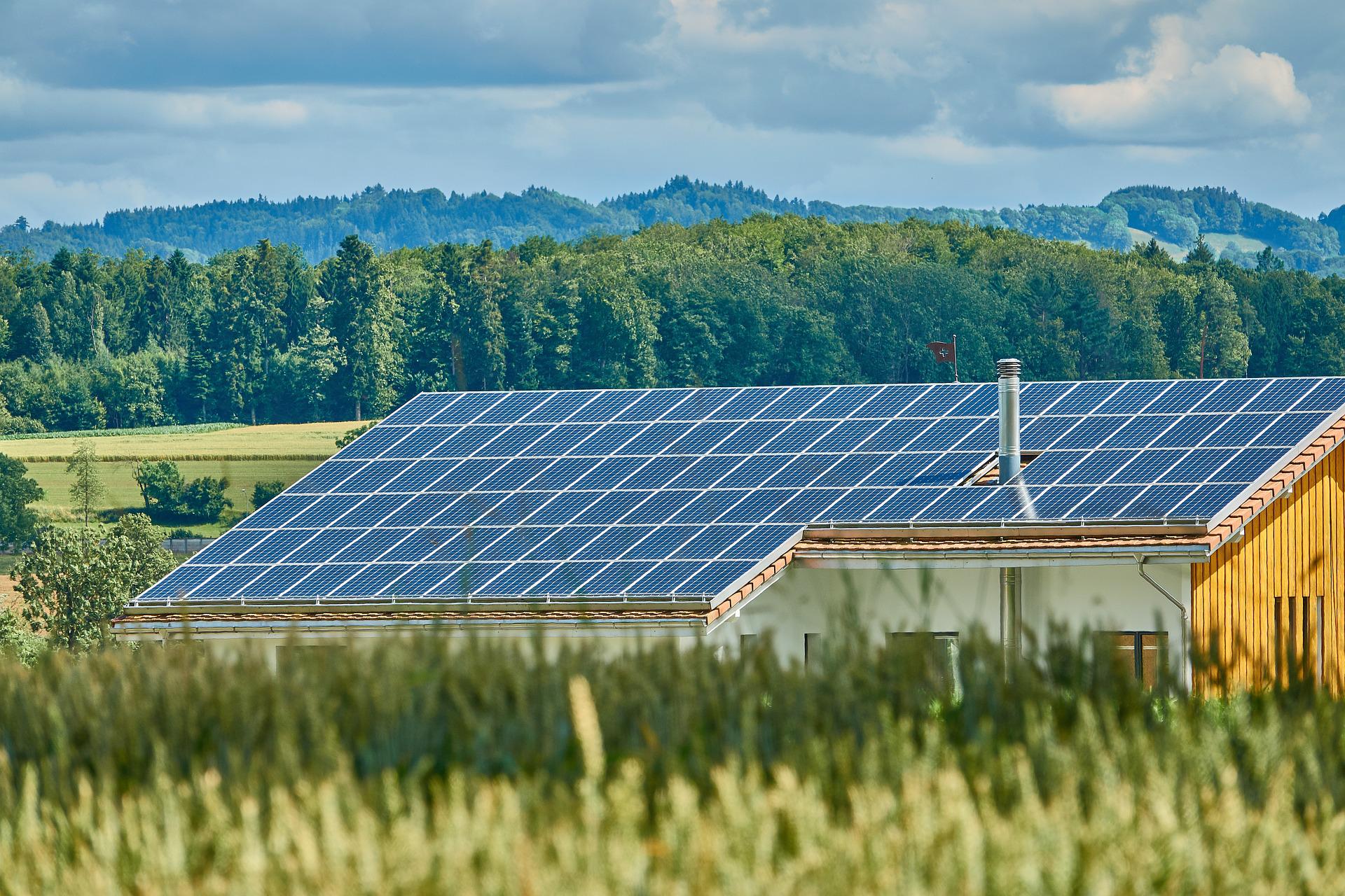 Industrial solar energy system is installed on the rooftop of a factory.